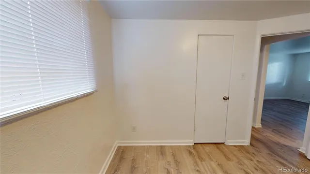 a view of small space with wooden floor