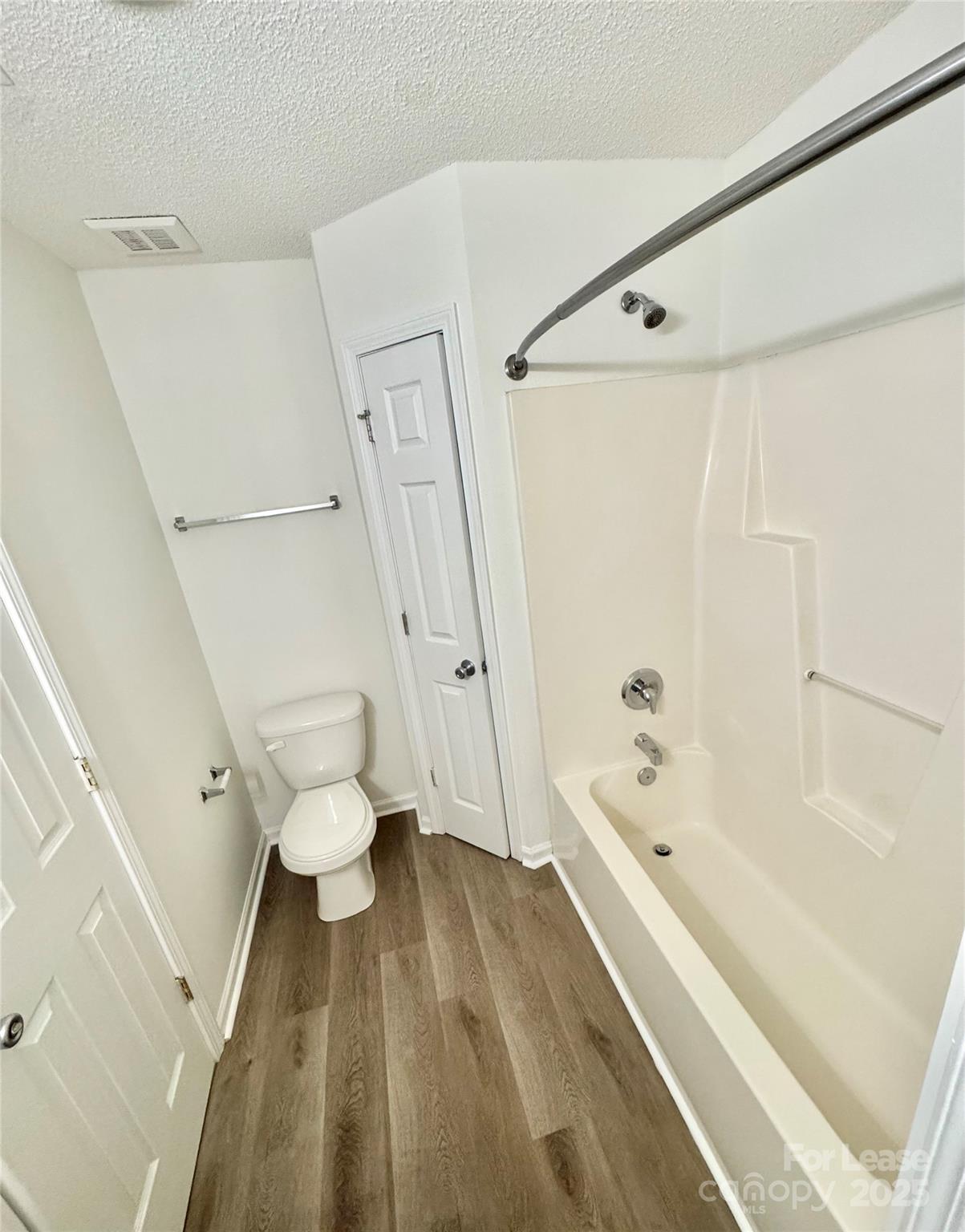 315 Flint Hill Road, Unit 202 Fort Mill, SC 29715 - Photo 11 of 14 a bathroom with a bathtub and a toilet