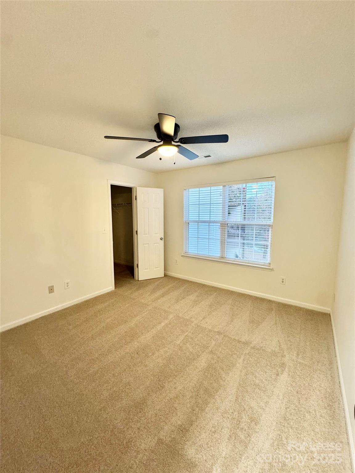 315 Flint Hill Road, Unit 202 Fort Mill, SC 29715 - Photo 12 of 14 a view of an empty room with a window