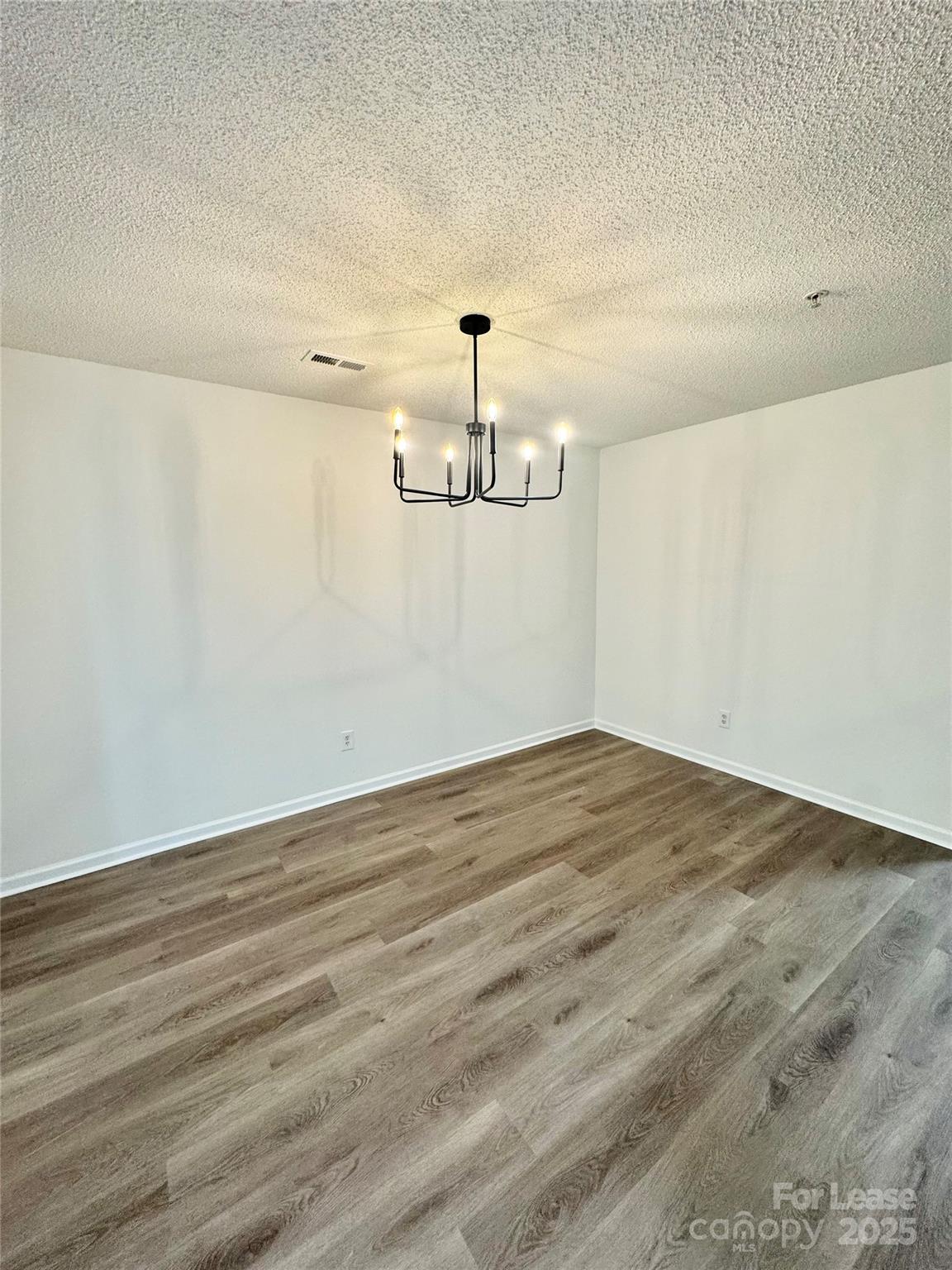 315 Flint Hill Road, Unit 202 Fort Mill, SC 29715 - Photo 5 of 14 wooden floor in an empty room