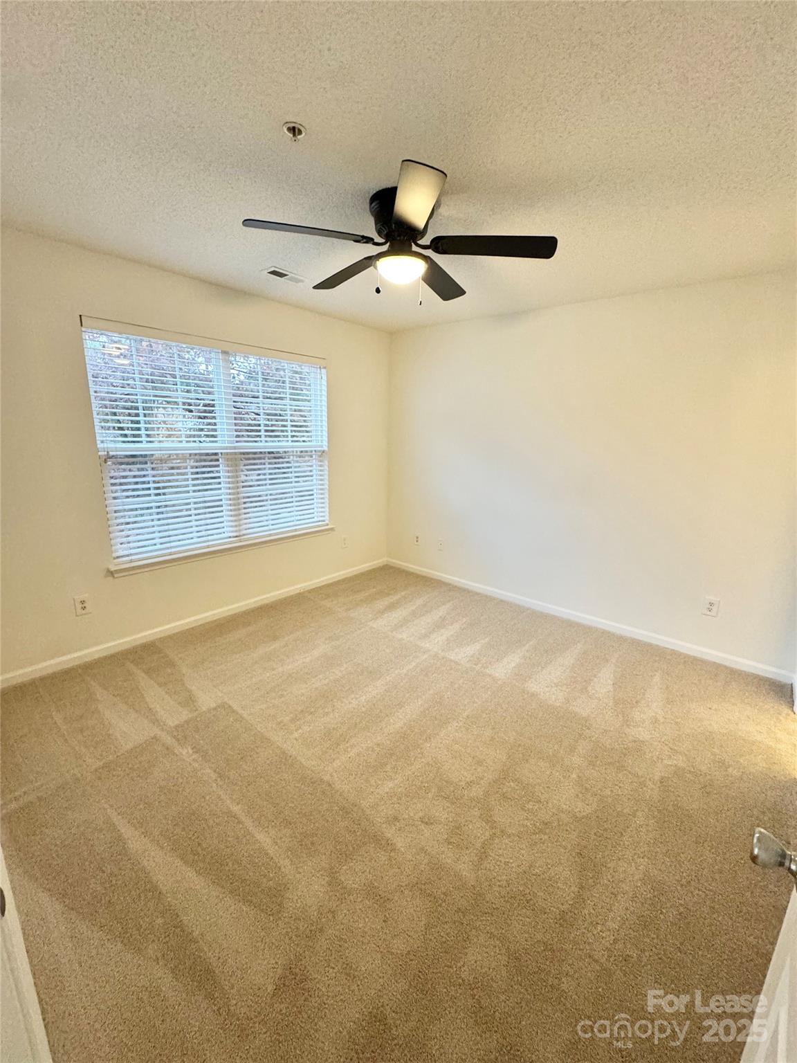 315 Flint Hill Road, Unit 202 Fort Mill, SC 29715 - Photo 8 of 14 a view of an empty room with a window