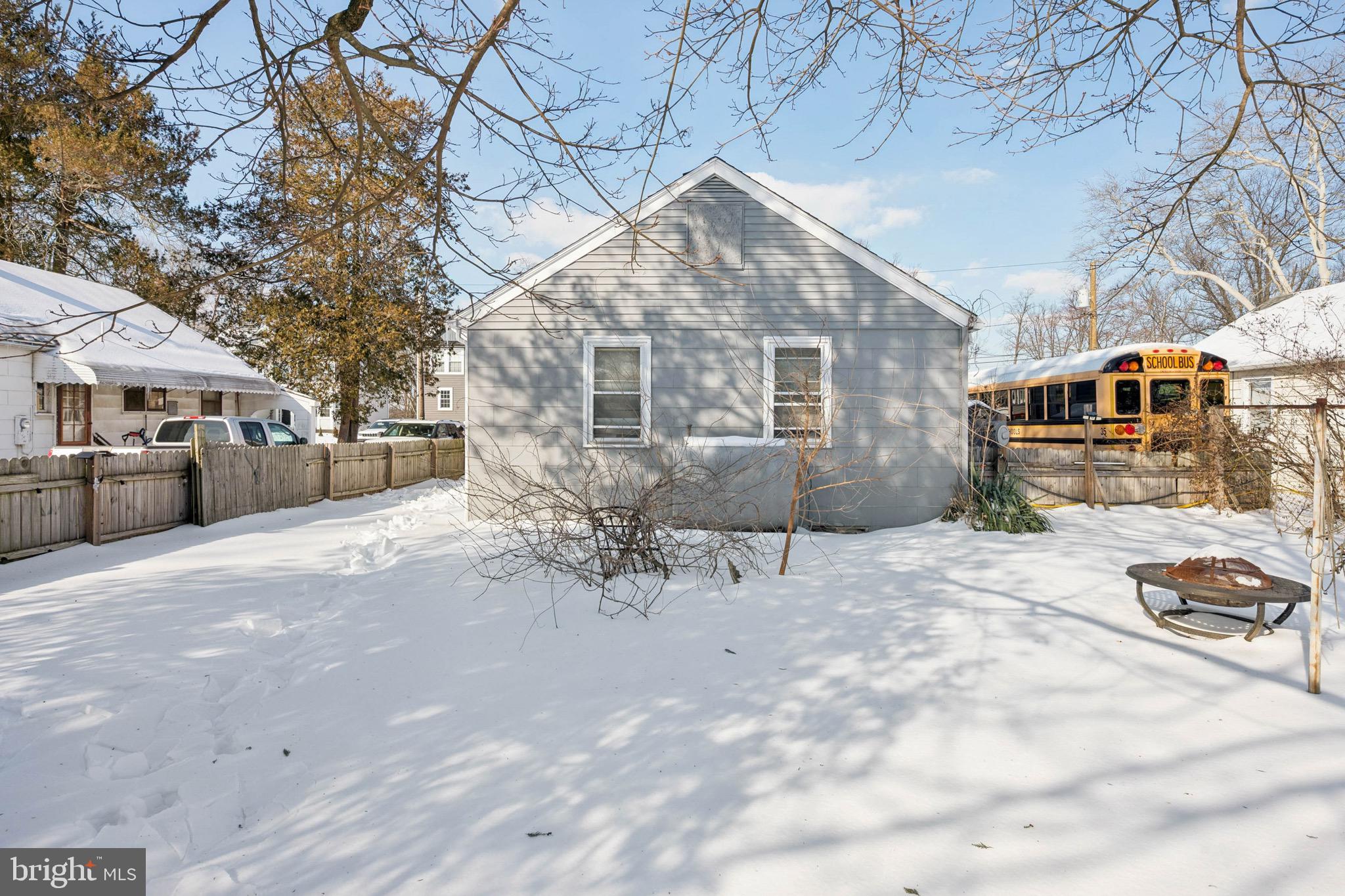 728 Haverford Avenue Maple Shade, NJ 08052 - Photo 4 of 17 a view of a blue house with snow on the road