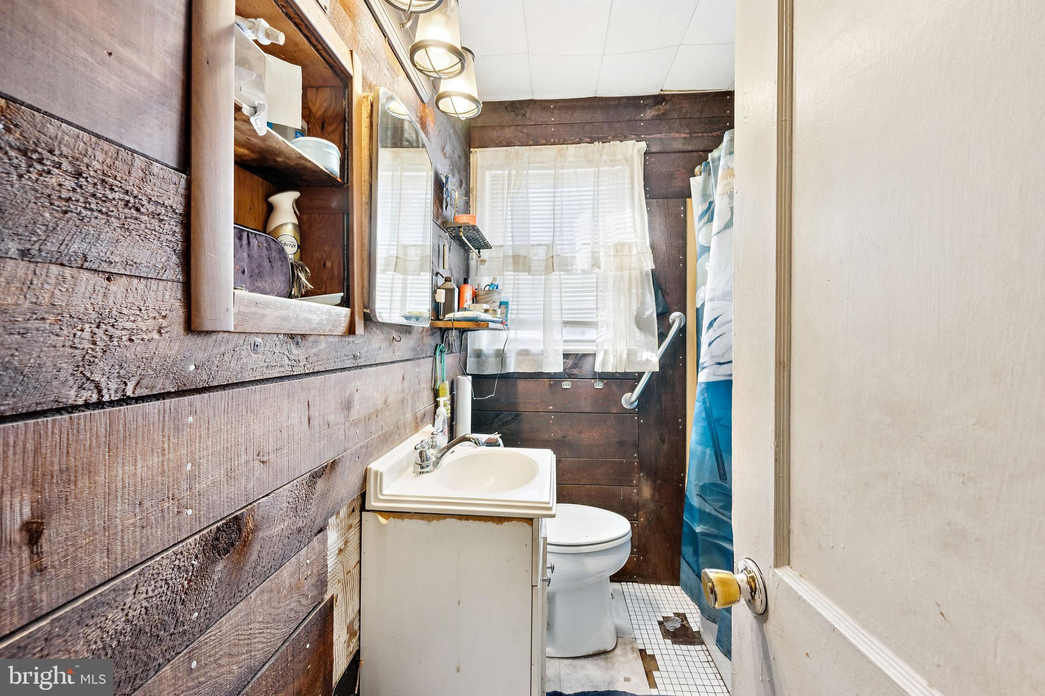 728 Haverford Avenue Maple Shade, NJ 08052 - Photo 7 of 17 a bathroom with a sink a toilet and a mirror