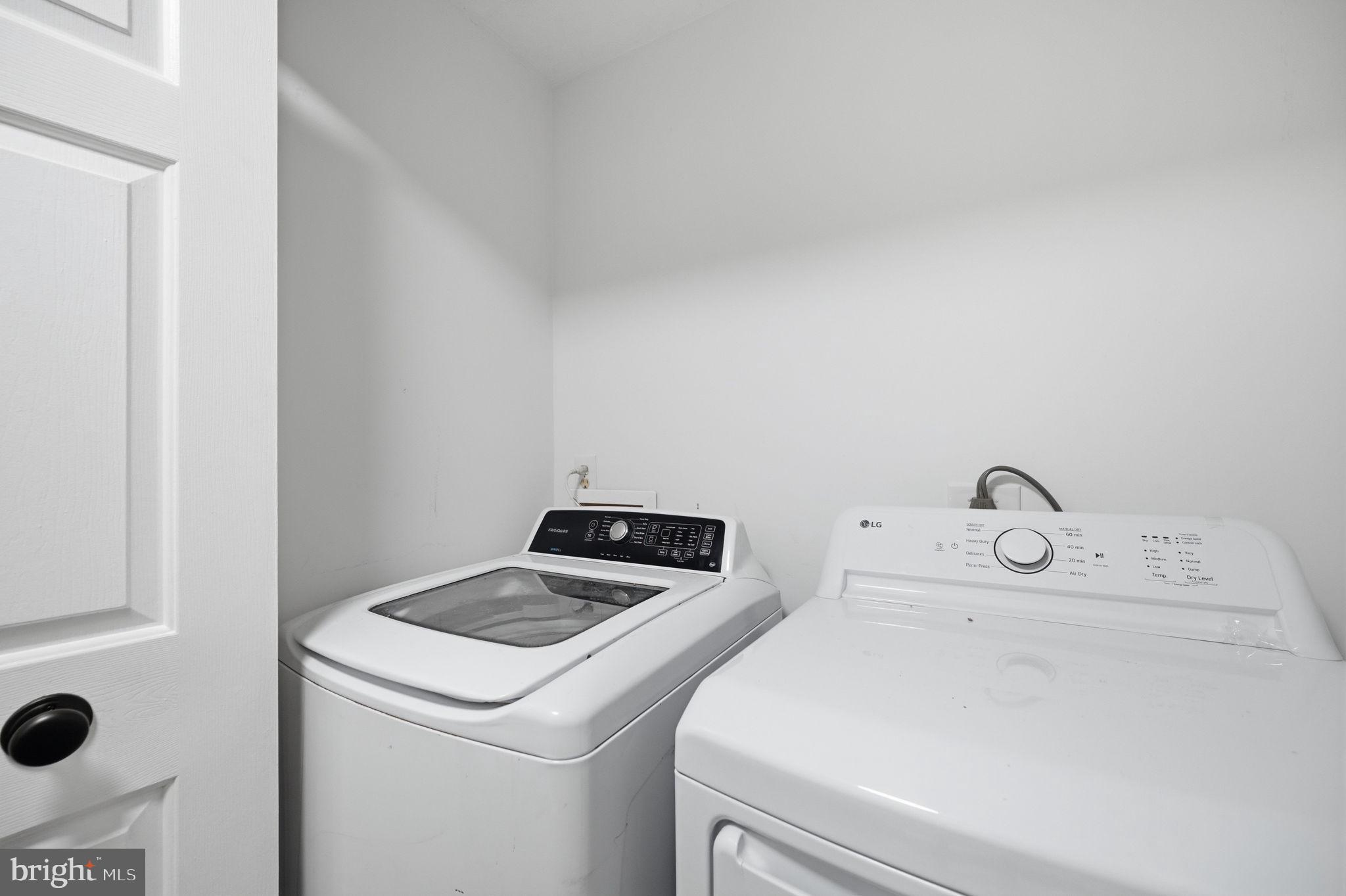 672 Ripplebrook Drive Culpeper, VA 22701 - Photo 22 of 26 Modern laundry space with sleek appliances.