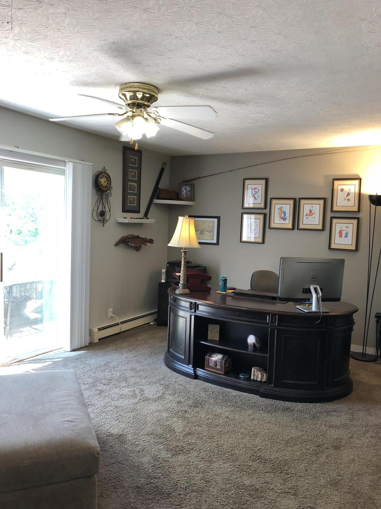 2221 Pratt Road Hop Bottom, PA 18824 - Photo 4 of 34 a living room with furniture and a chandelier