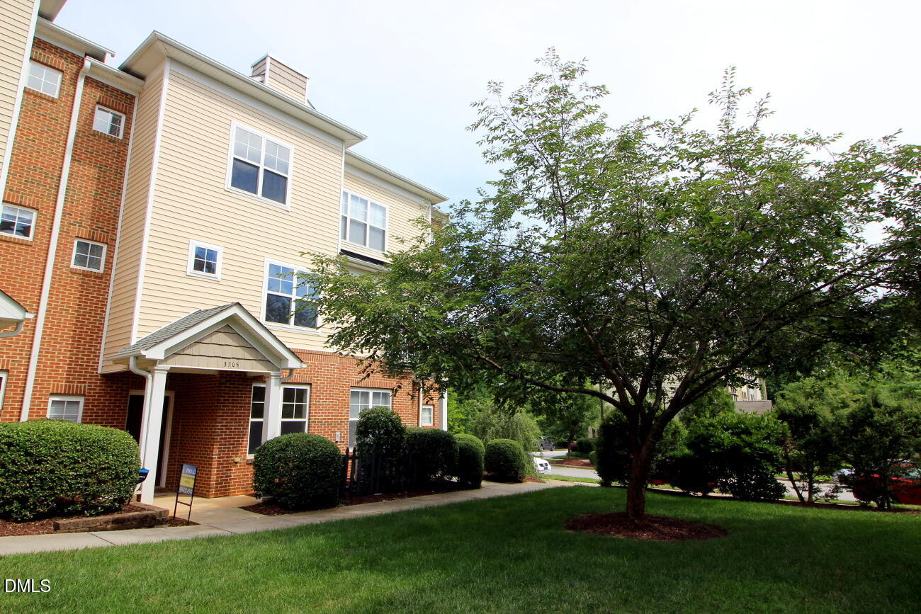 3705 Glenhaven Road Raleigh, NC 27606 - Photo 1 of 21 a view of house with a yard