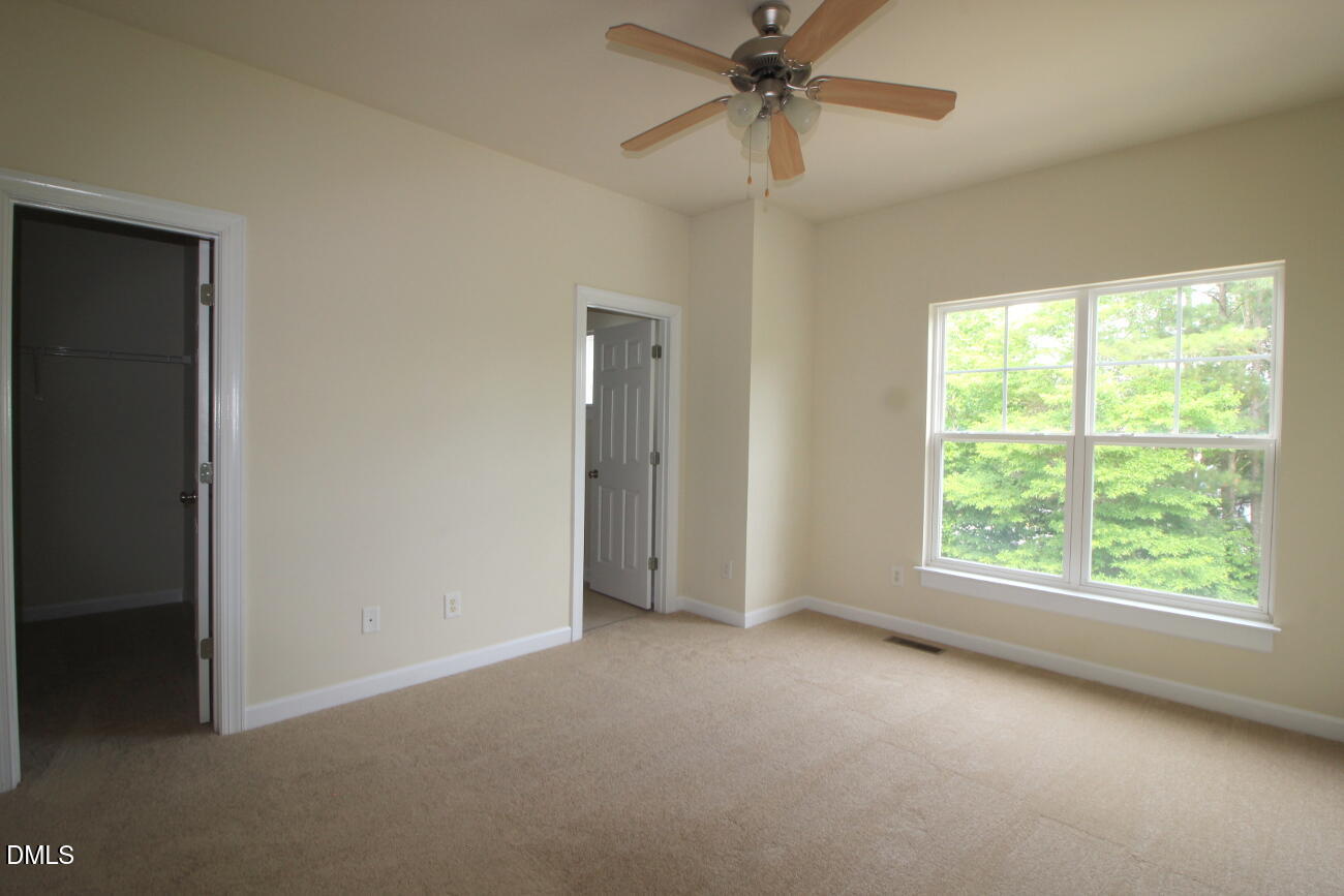 3705 Glenhaven Road Raleigh, NC 27606 - Photo 9 of 21 a view of an empty room with a window