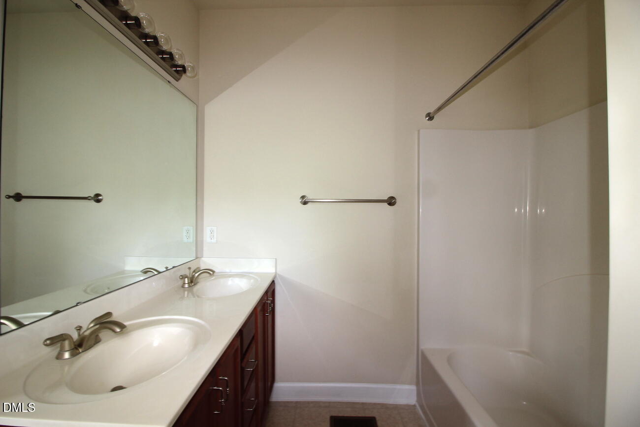 3705 Glenhaven Road Raleigh, NC 27606 - Photo 10 of 21 a bathroom with a sink and a tub