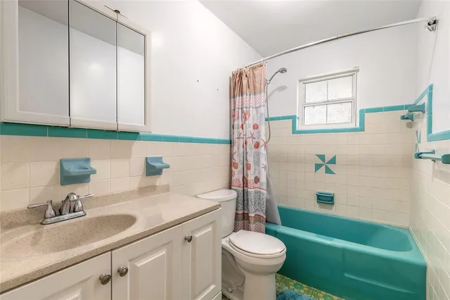 a bathroom with a sink a toilet and a bathtub