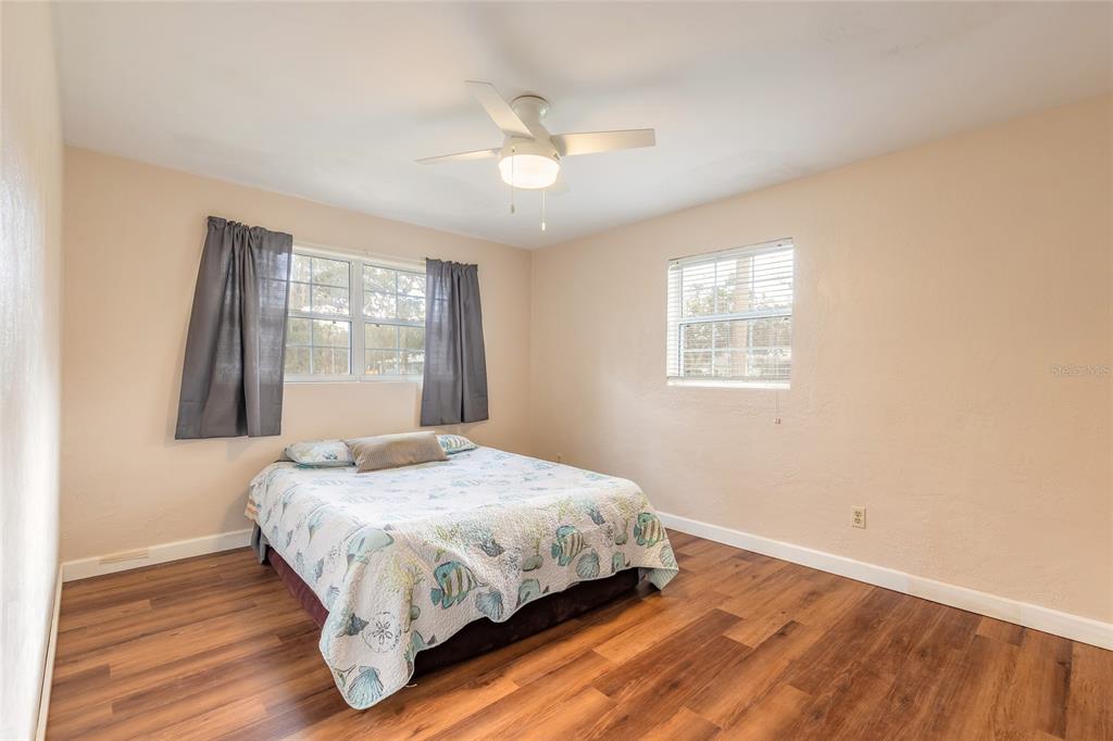 223 Charles Street Port Orange, FL 32129 - Photo 12 of 20 a bedroom with a bed and window