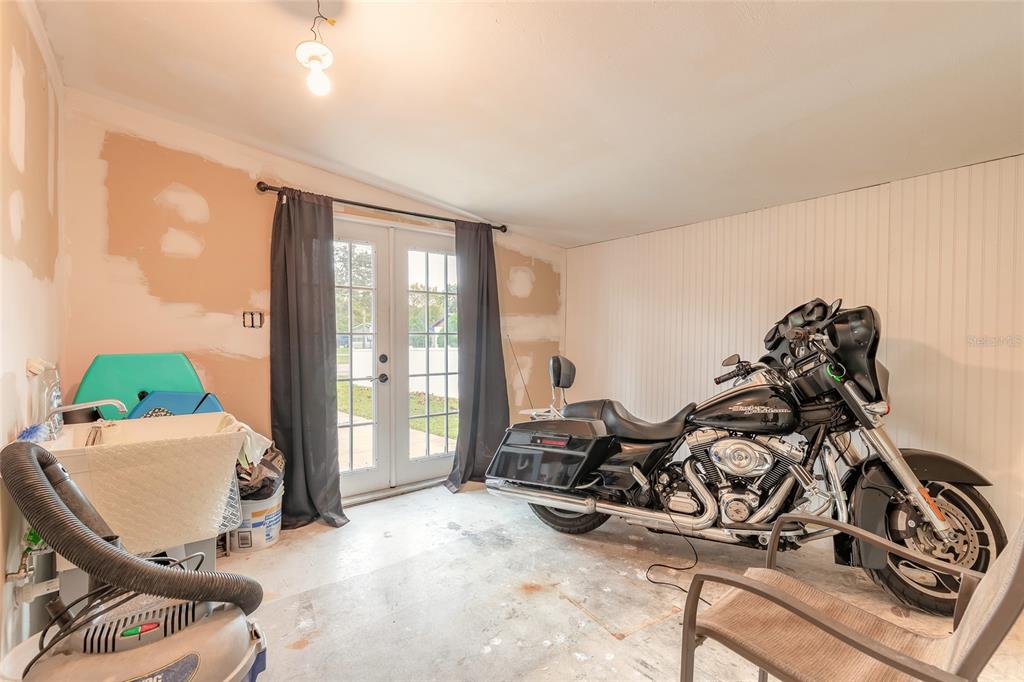 223 Charles Street Port Orange, FL 32129 - Photo 14 of 20 a view of a room with gym equipment