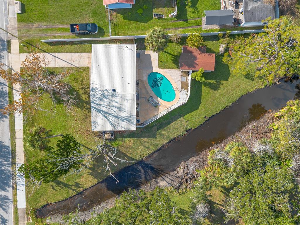 223 Charles Street Port Orange, FL 32129 - Photo 18 of 20 a view of a back yard of the house