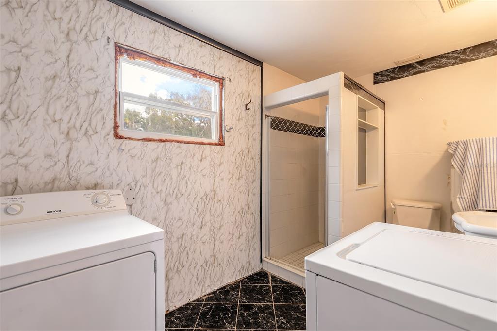 223 Charles Street Port Orange, FL 32129 - Photo 9 of 20 a bathroom with a sink and a mirror