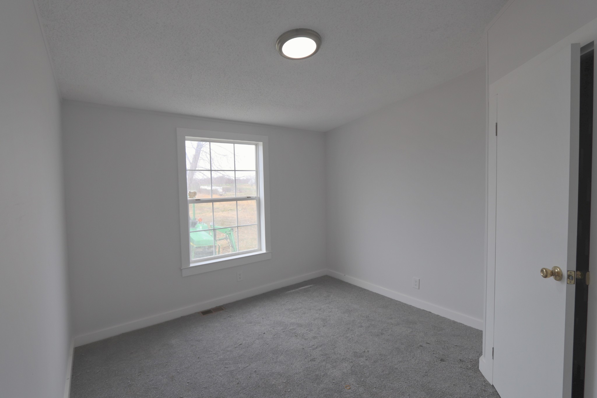 539 Cook Road Portland, TN 37148 - Photo 13 of 17 an empty room with windows and view of rack
