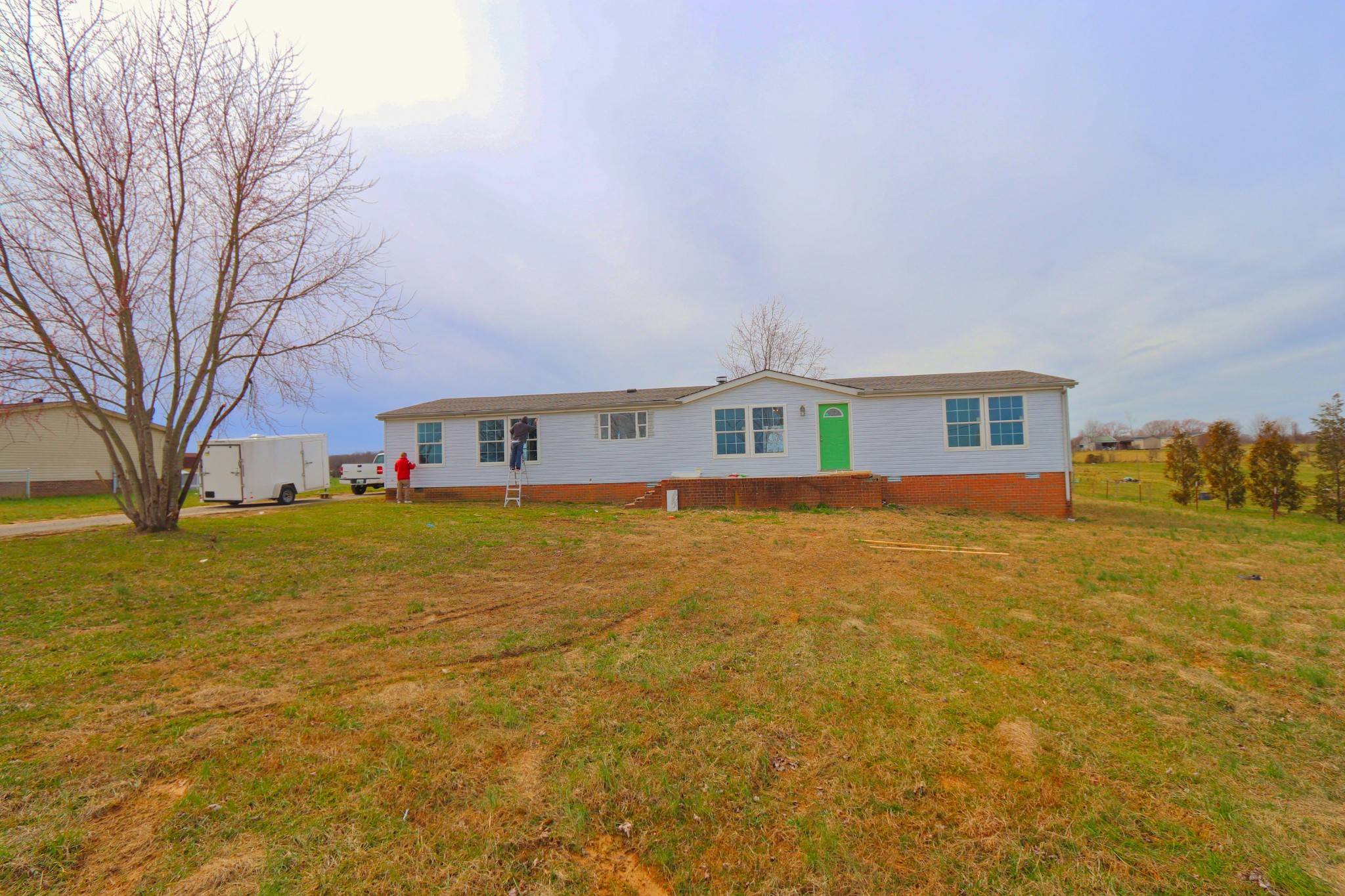 539 Cook Road Portland, TN 37148 - Photo 17 of 17 a front view of a house with a big yard and large trees