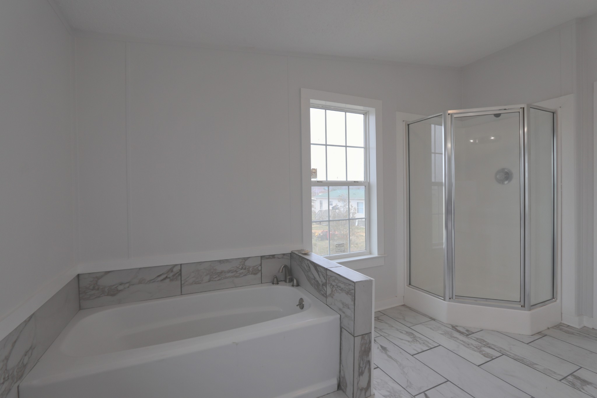 539 Cook Road Portland, TN 37148 - Photo 9 of 17 a bathroom with a bathtub and window