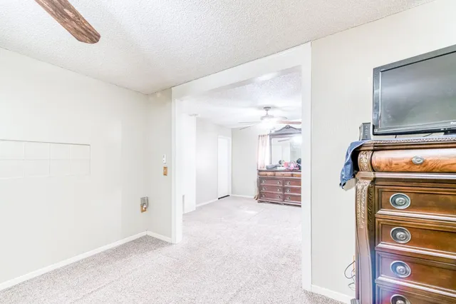 a view of livingroom with washer and dryer