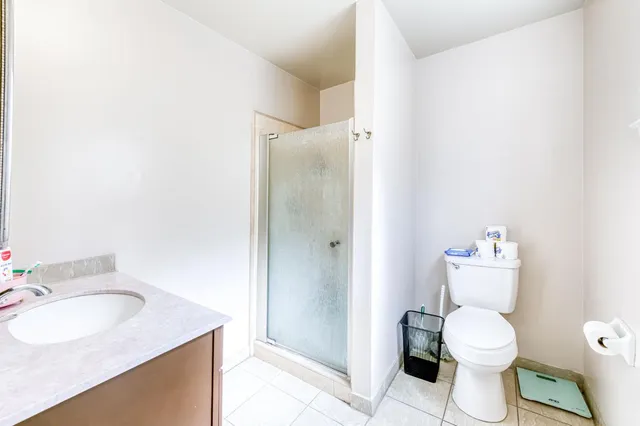 a bathroom with a sink toilet and a mirror