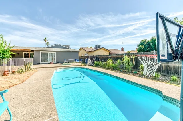 a view of a house with a swimming pool