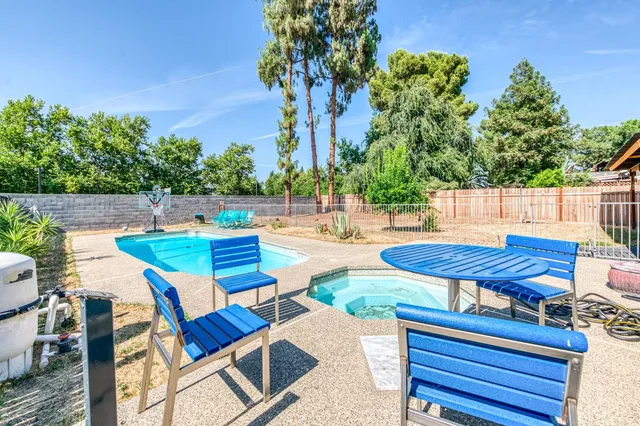 a view of a chairs and table in the patio