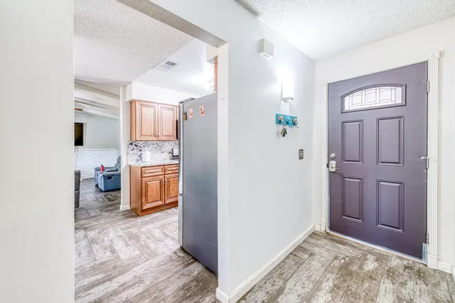 a view of a kitchen and utility room