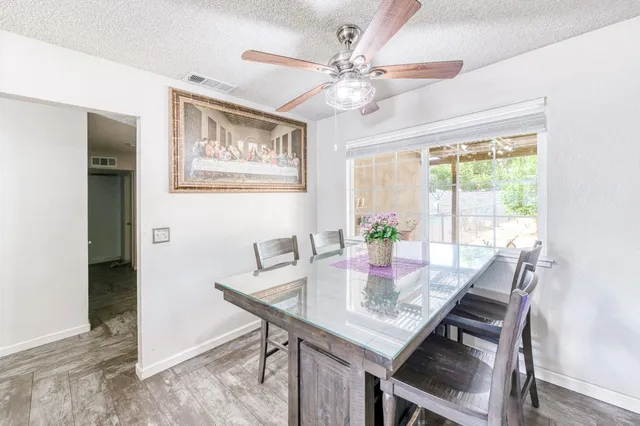 a view of a dining room with furniture window and outside view