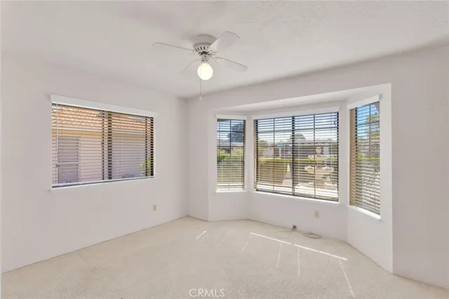a living room with cabinets and window