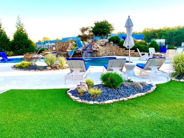 a view of a house with a backyard