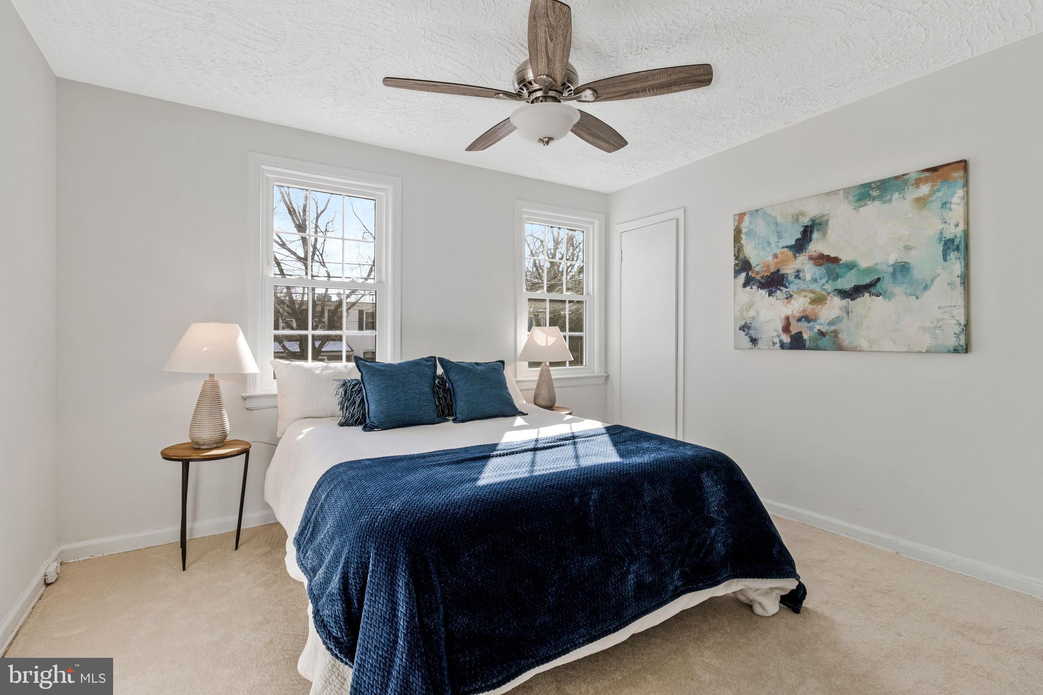4332 Polk Street Northeast Washington, DC 20019 - Photo 12 of 22 a bedroom with a bed and a painting on the wall