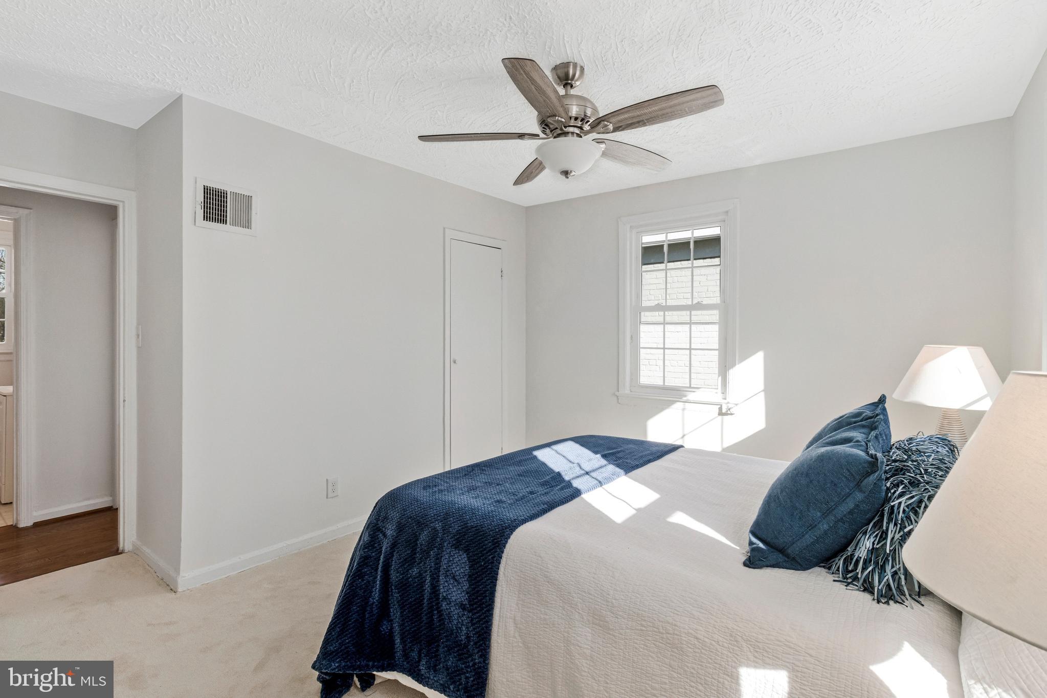 4332 Polk Street Northeast Washington, DC 20019 - Photo 13 of 22 a bedroom with a large bed and a window