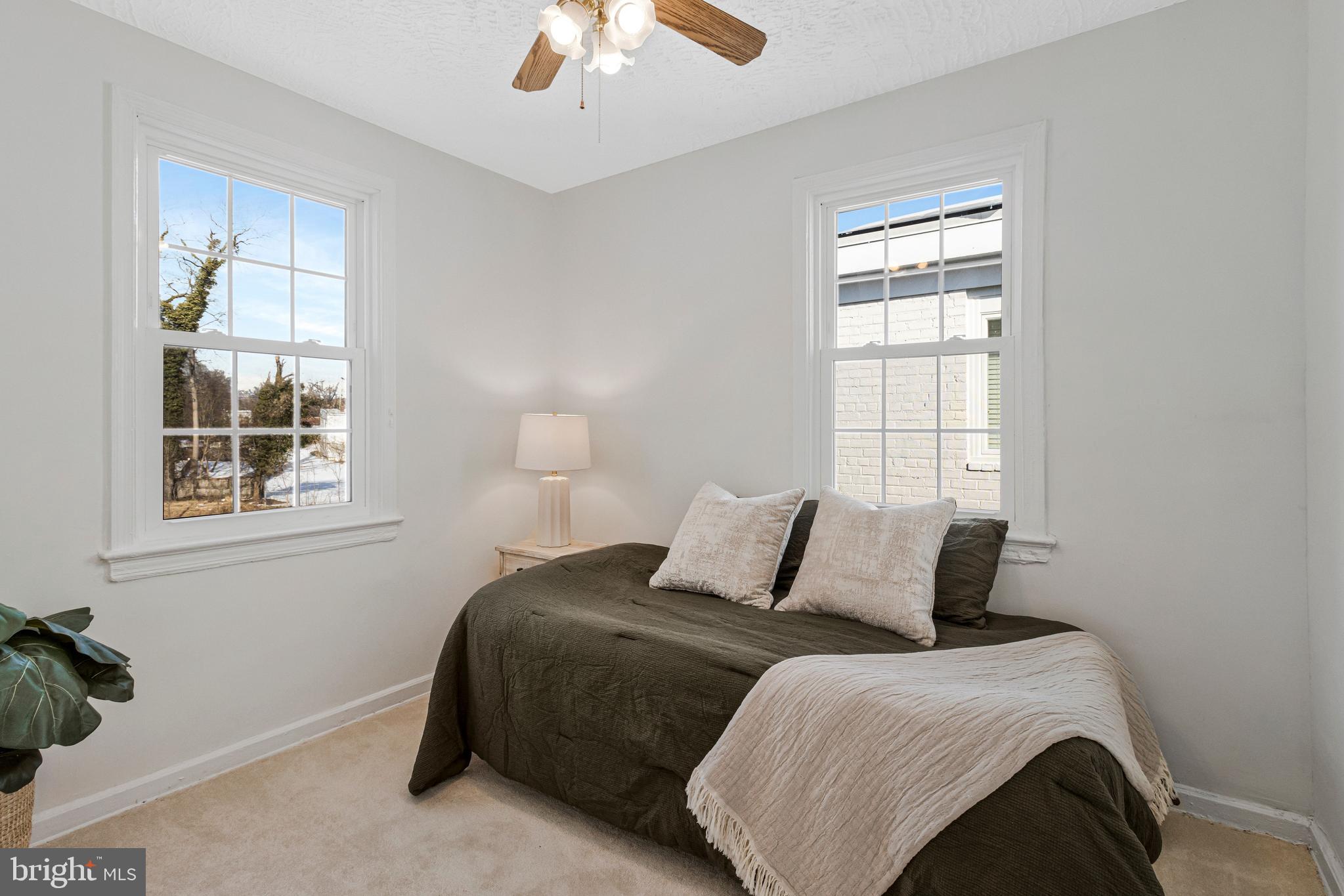 4332 Polk Street Northeast Washington, DC 20019 - Photo 16 of 22 a bedroom with a bed and a window