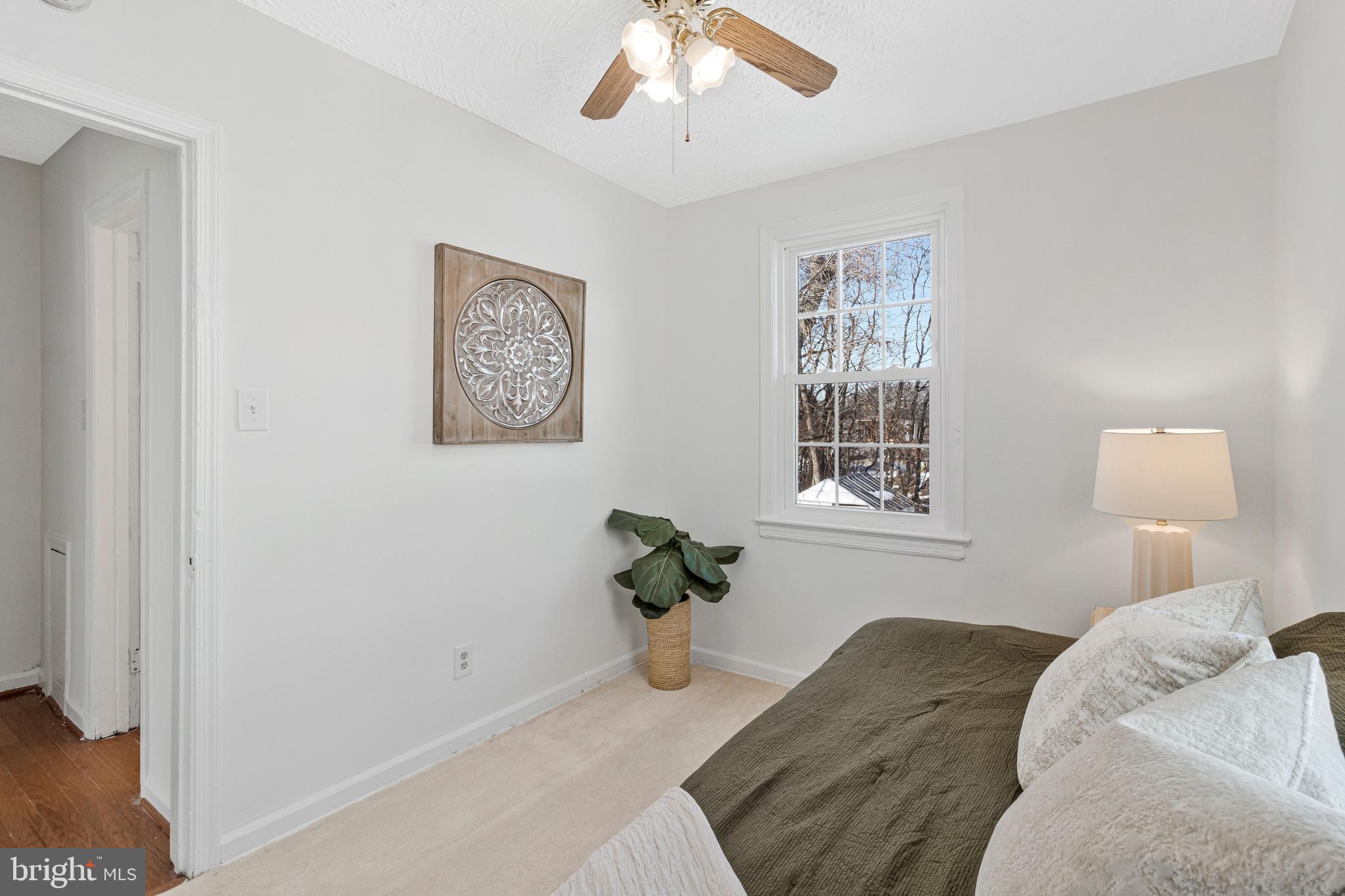4332 Polk Street Northeast Washington, DC 20019 - Photo 17 of 22 a bedroom with a bed and a window