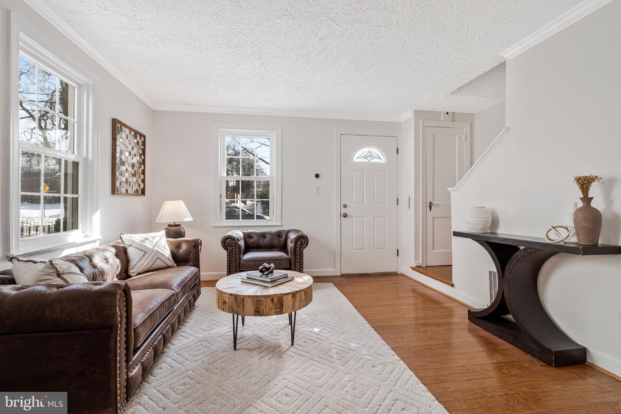 4332 Polk Street Northeast Washington, DC 20019 - Photo 3 of 22 a living room with furniture a rug and a window