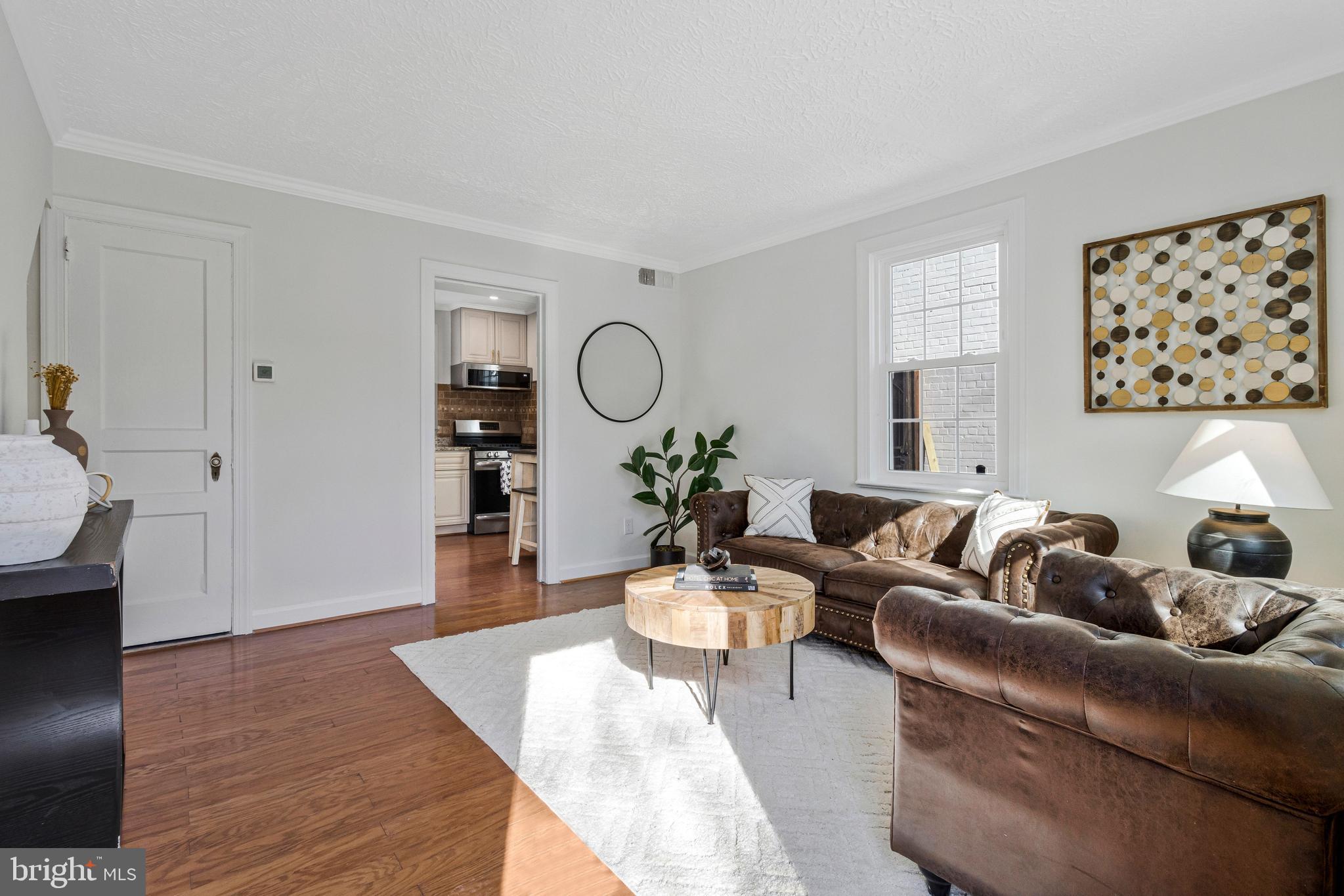 4332 Polk Street Northeast Washington, DC 20019 - Photo 4 of 22 a living room with furniture and wooden floor