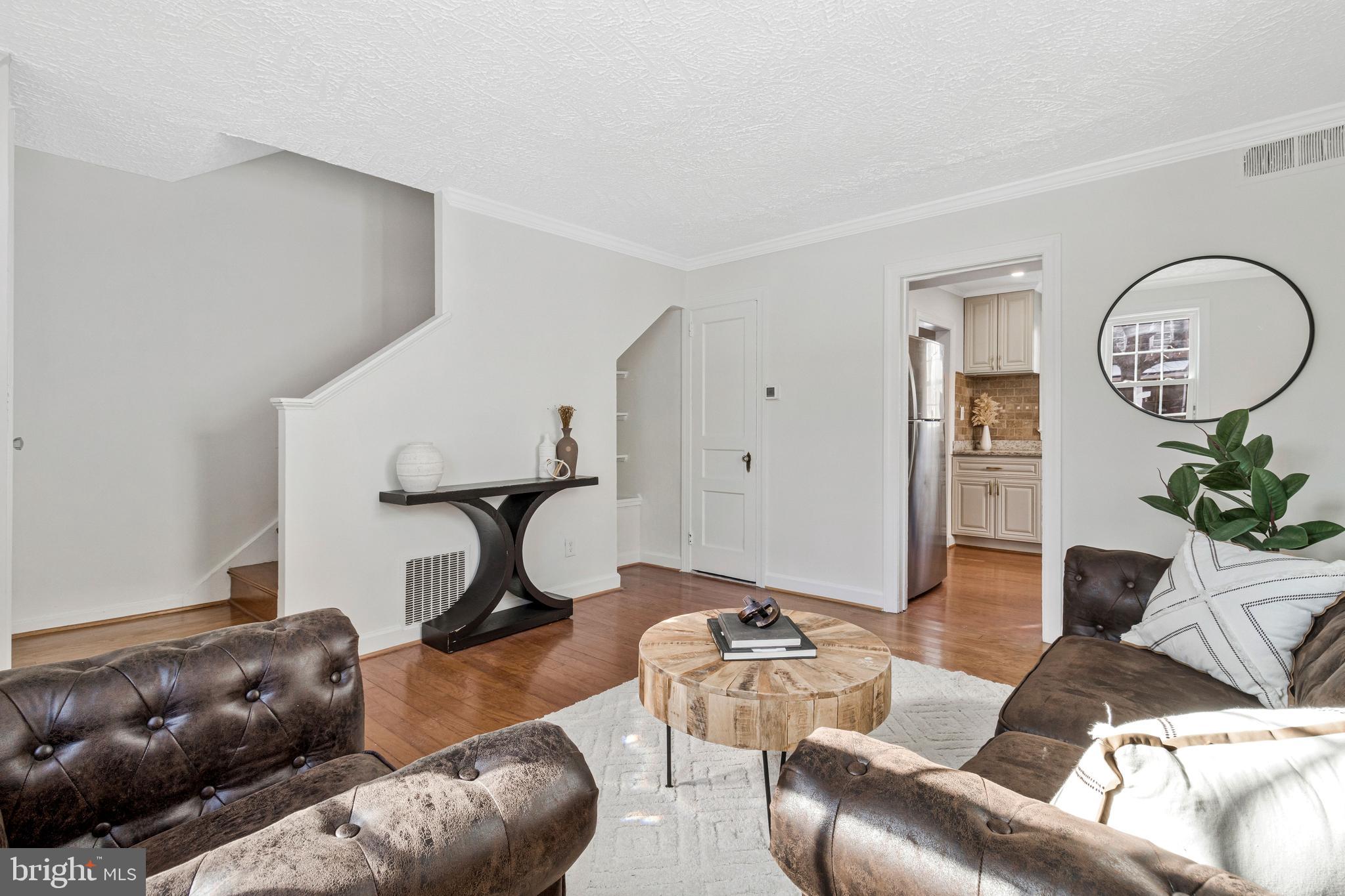 4332 Polk Street Northeast Washington, DC 20019 - Photo 6 of 22 a living room with furniture and wooden floor