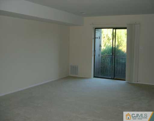 1526 Raspberry Court Edison, NJ 08817 - Photo 4 of 7 an empty room with a window