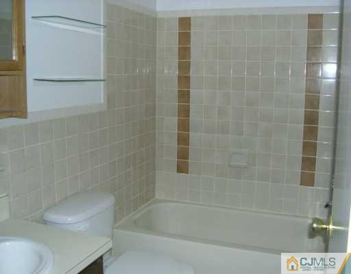1526 Raspberry Court Edison, NJ 08817 - Photo 5 of 7 a bathroom with a shower and a bathtub