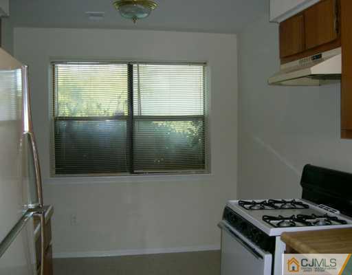 1526 Raspberry Court Edison, NJ 08817 - Photo 7 of 7 a room with wooden floor and a window
