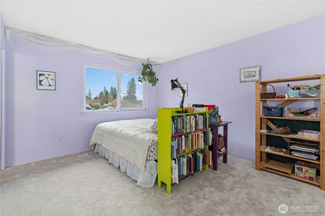 a bedroom with a bed and a walk in closet