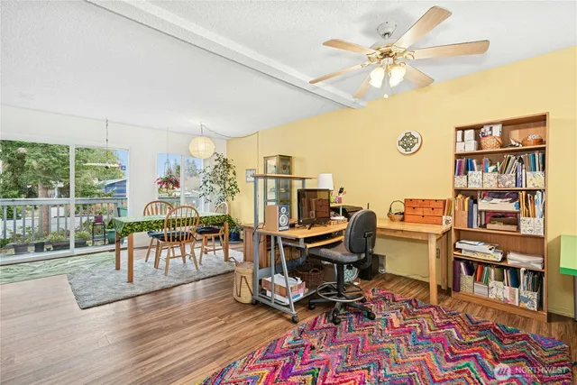a work room with furniture and wooden floor