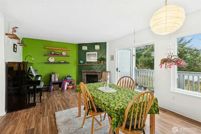 a view of a dining room with furniture and chandelier