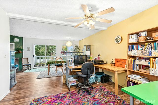 a work room with furniture and wooden floor