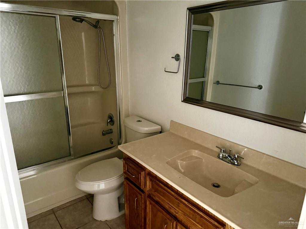 7113 North 8th Street, Unit A McAllen, TX 78504 - Photo 8 of 9 a bathroom with a sink a toilet and shower