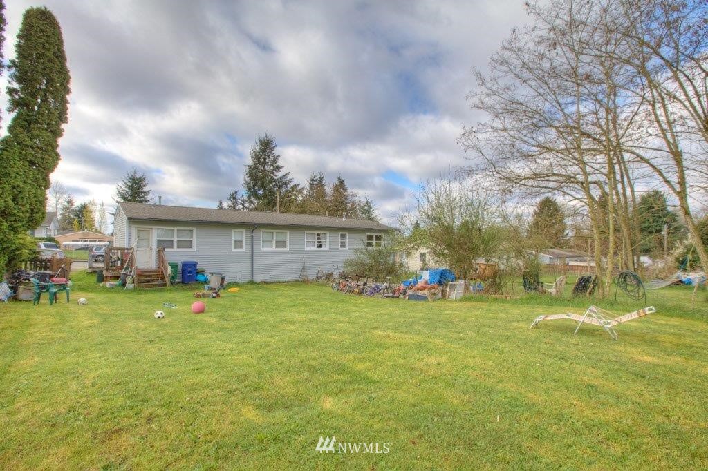 2818 Northeast 6th Place Renton, WA 98056 - Photo 11 of 11 a view of a house with a yard and sitting area