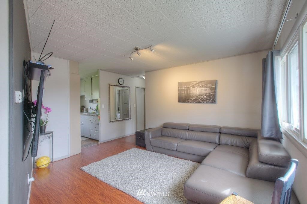 2818 Northeast 6th Place Renton, WA 98056 - Photo 4 of 11 a living room with furniture and a window