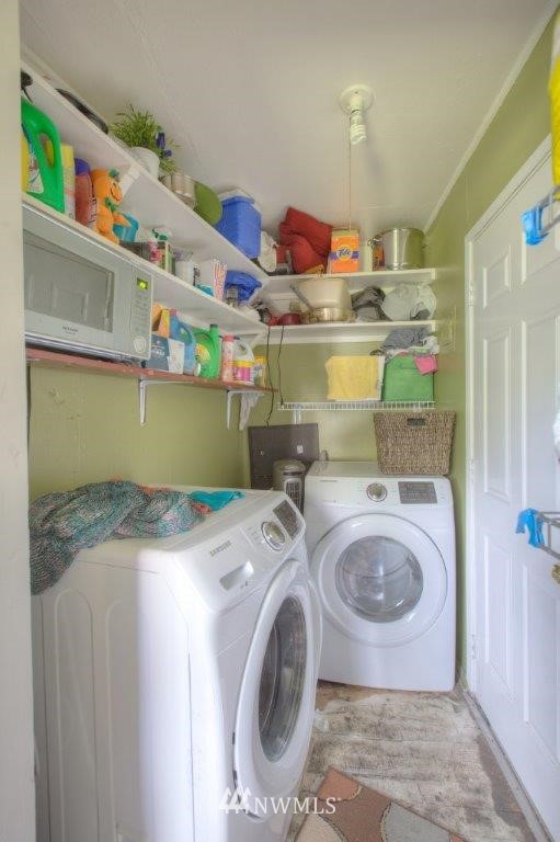 2818 Northeast 6th Place Renton, WA 98056 - Photo 9 of 11 a utility room with dryer and washer