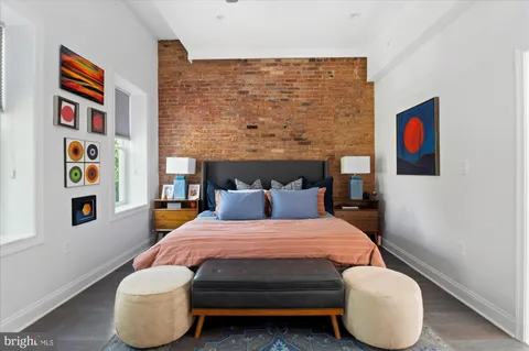 a bedroom with a bed and a couch