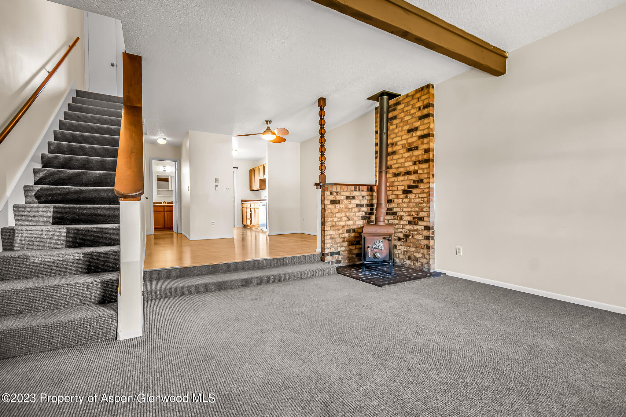 1006 Wamsley Way Rifle, CO 81650 - Photo 3 of 16 a view of an empty room with stairs