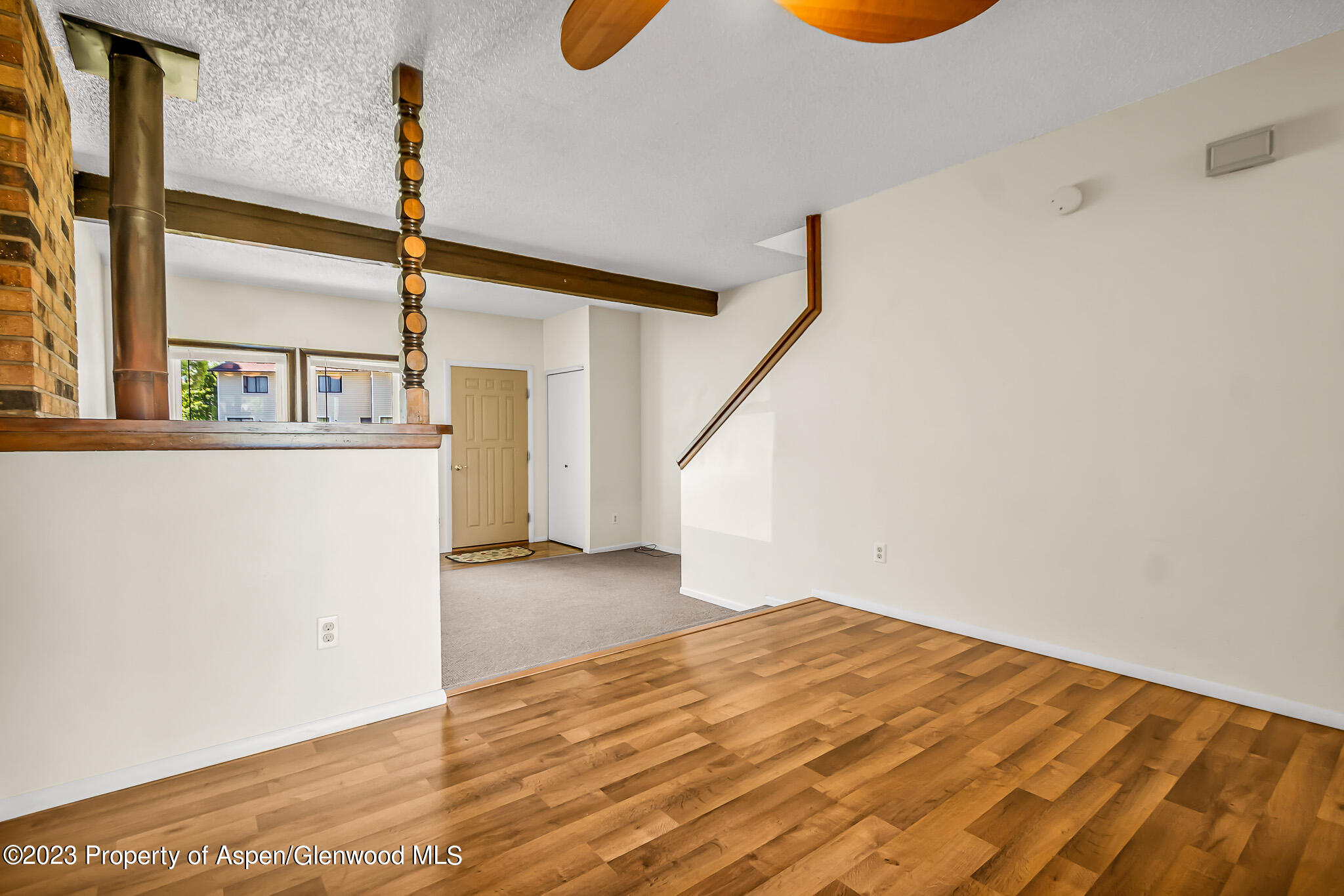 1006 Wamsley Way Rifle, CO 81650 - Photo 5 of 16 a view of a room with wooden floor and windows