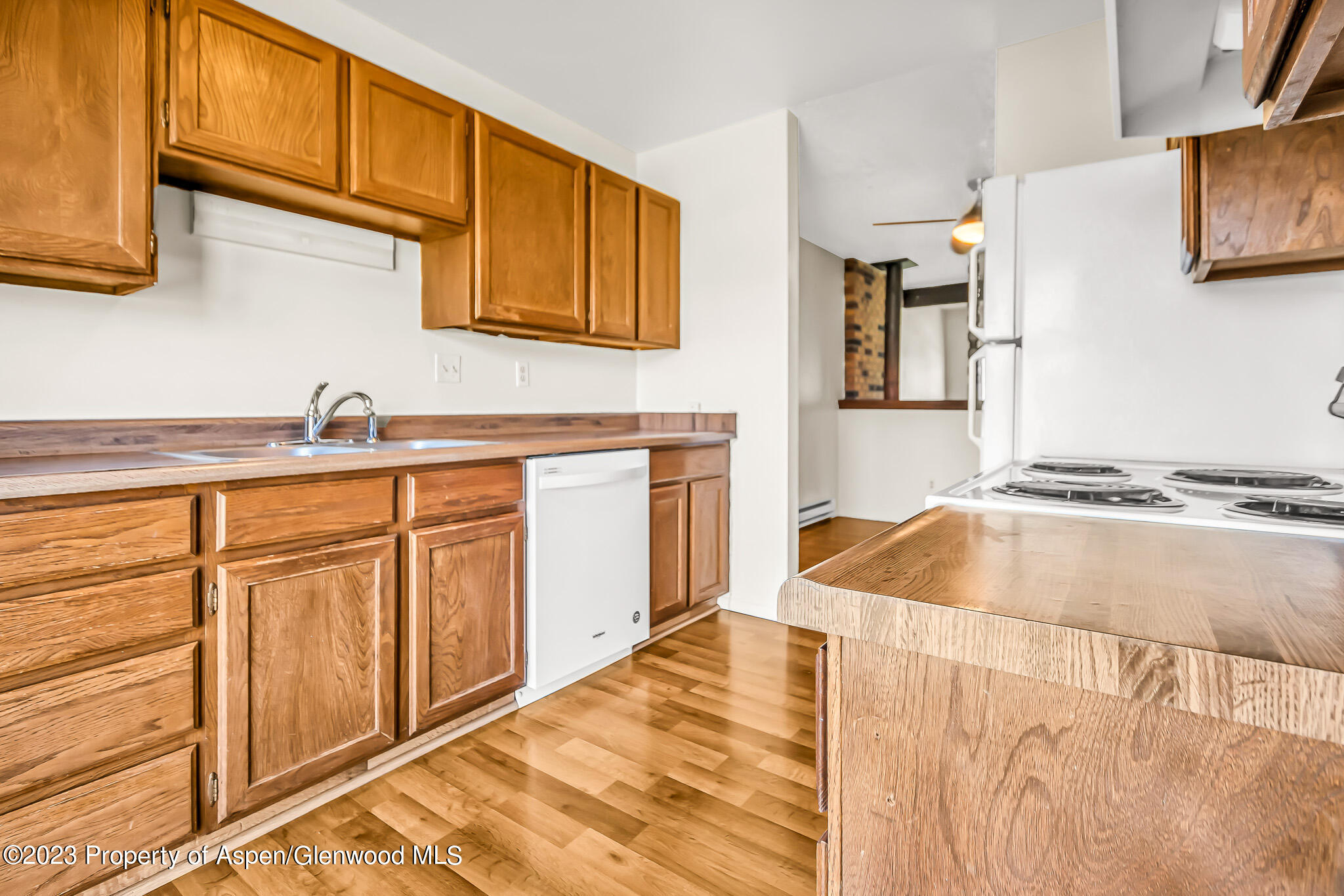 1006 Wamsley Way Rifle, CO 81650 - Photo 7 of 16 a kitchen with granite countertop a sink and cabinets